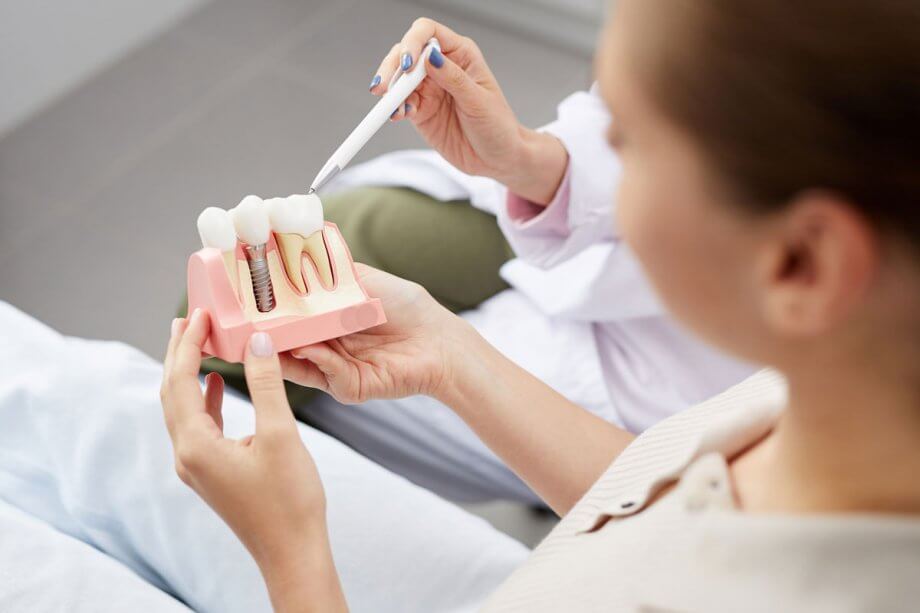 dental implant patient talking with doctor