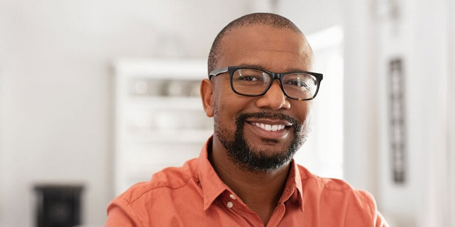 man smiling with glasses