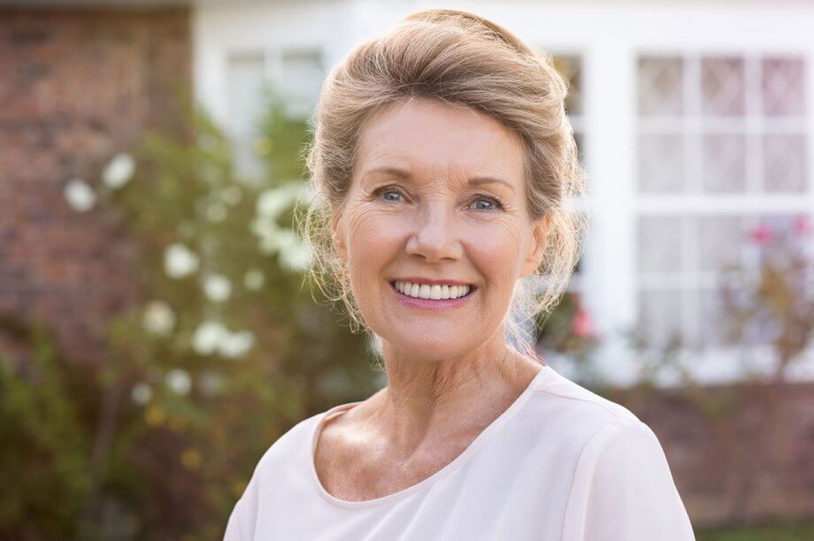 mature woman with dentures and smiling