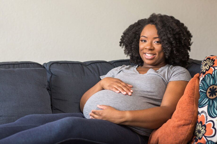 pregnant woman on a couch